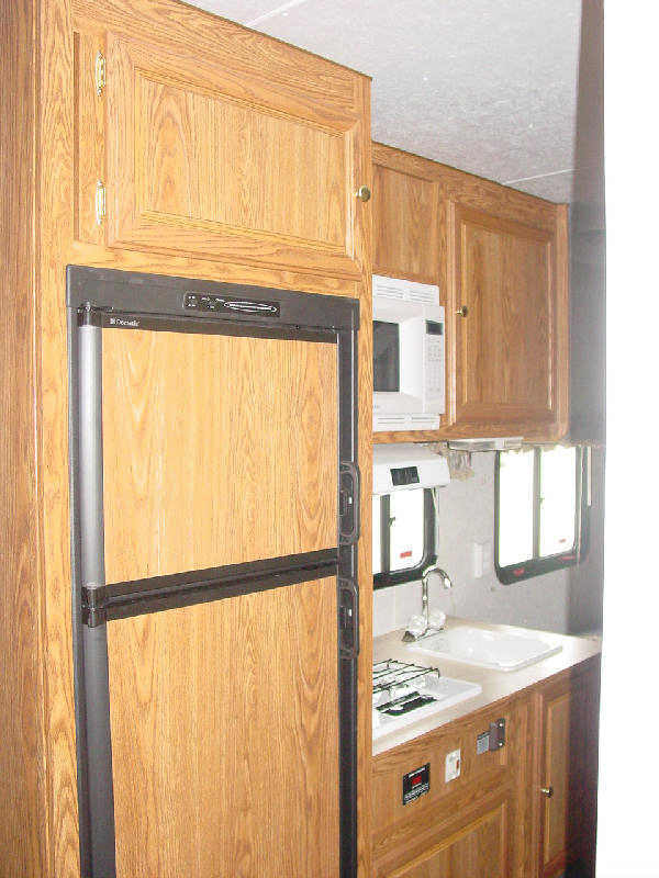 Millennium Escape kitchen picture.  This picture shows the sink, microwave, refrigerator, freezer 