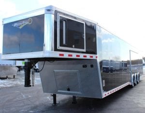 enclosed gooseneck trailer with removeable wheel well and generator door