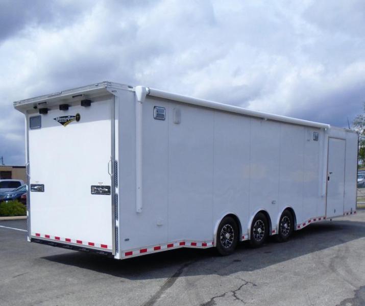 Enclosed Race Car Hauler 2023 32' 3/6k Spread Axles Rear Wing Sony Stereo Electric Awning