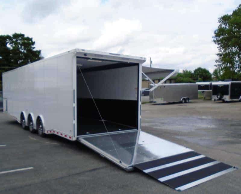 Enclosed Race Car Hauler 2023 32' 3/6k Spread Axles Rear Wing Sony Stereo Electric Awning