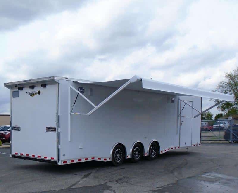 Enclosed Race Car Hauler 2023 32' 3/6k Spread Axles Rear Wing Sony Stereo Electric Awning