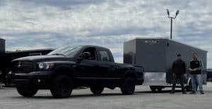 Black Dodge truck with Vnose Enclosed Trailer