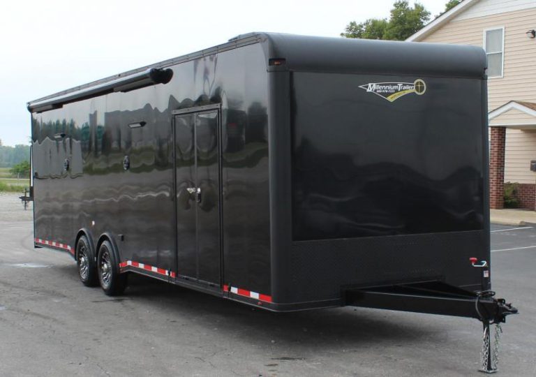 Enclosed Car Hauler 2023 30' Front Exterior Curbside View. Electric Awning, Double Side Door, LED Lights, Speakers, Aluminum Wheels.