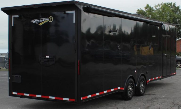 Enclosed Car Hauler 2023 30' Exterior Rear Curbside View. Electric Awning, Rear Ramp Door, Aluminum Wheels, Double Side Door, LED Lights.