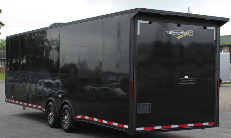 Enclosed Car Hauler 2023 30' Exterior Roadside View. Black .040 Screwless Exterior, Aluminum Wheels, Generator Door, Rear Ramp Door.