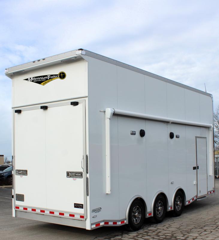Stacker Trailer 2024 24' Aluminum Icon Performance Rear Curbside View. This features an electric awning, speakers, LED lights, side door, aluminum wheels, rear wing, & rear ramp door.
