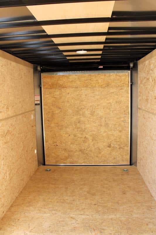 Enclosed Cargo Trailer 2024 7' X 14' Interior Rear View. 7' Interior, D-Rings, Engineered Sidewalls & Flooring, Rear Ramp Door with Flap.