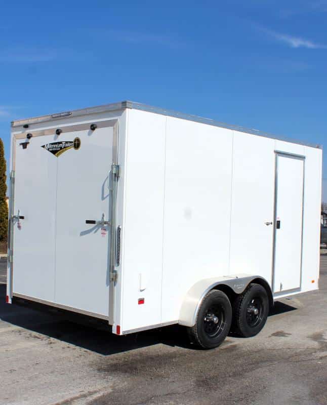 Enclosed Cargo Trailer 2024 7' X 14' Exterior Curbside View. White PolyCor Exterior, Black Mod Wheels, Bar-lock Rear Ramp Door, & Side Door.