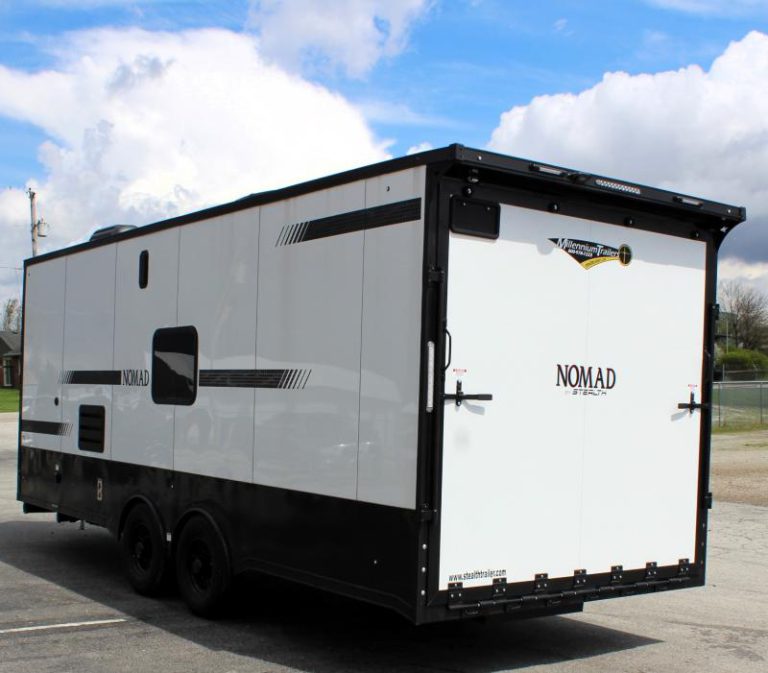 Enclosed Car Trailer with Living Quarters Rear Roadside View with black-out package, rear ramp door, & rear wing.