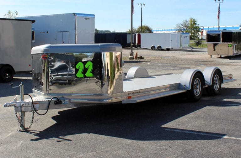 Used car hauler 2021 22' Ultra Sundowner. It includes and enclosed v-nose front, Ninja Warrior winch, slide-out ramps, removeable fenders, & extruded aluminum floor.