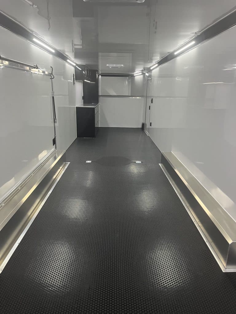 Interior view showing black cabinets and black coin flooring