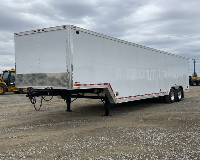 a trailer sitting in the middle of an empty parking lot