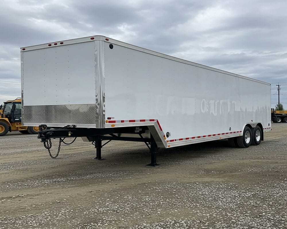 a trailer sitting in the middle of an empty parking lot
