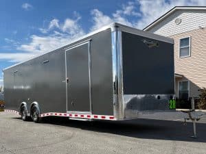 Enclosed Car Hauler 2026 28ft. Aluminum Extreme w/6K Torsion Spread Axles, Finished Interior w/Cabinets & Alum. Wheels 0594