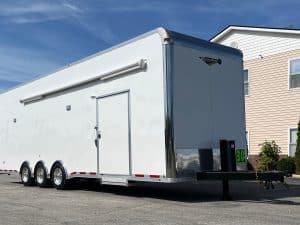 Used Enclosed Car Trailer 2025 30ft. Platinum w/Air Ride Suspension & Electric Over Hydraulic Brakes 0163