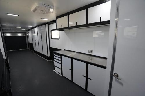 Custom Enclosed Gooseneck Trailer with Bathroom Rear Interior Cabinet View