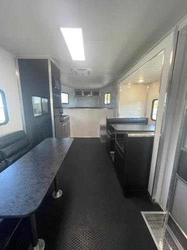 Custom Charcoal 48' Millennium Platinum Enclosed Gooseneck Trailer Front Longue View